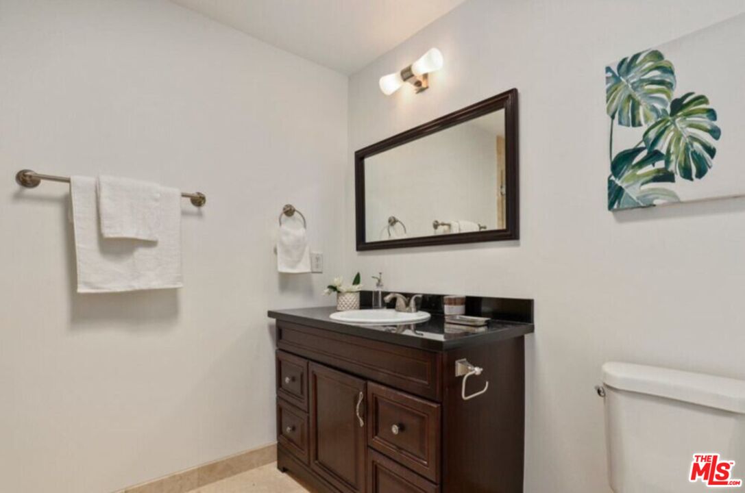 6624 South Springpark Avenue, Unit 5A Los Angeles, CA 90056 - Photo 17 of 23 a bathroom with a sink a vanity and a mirror