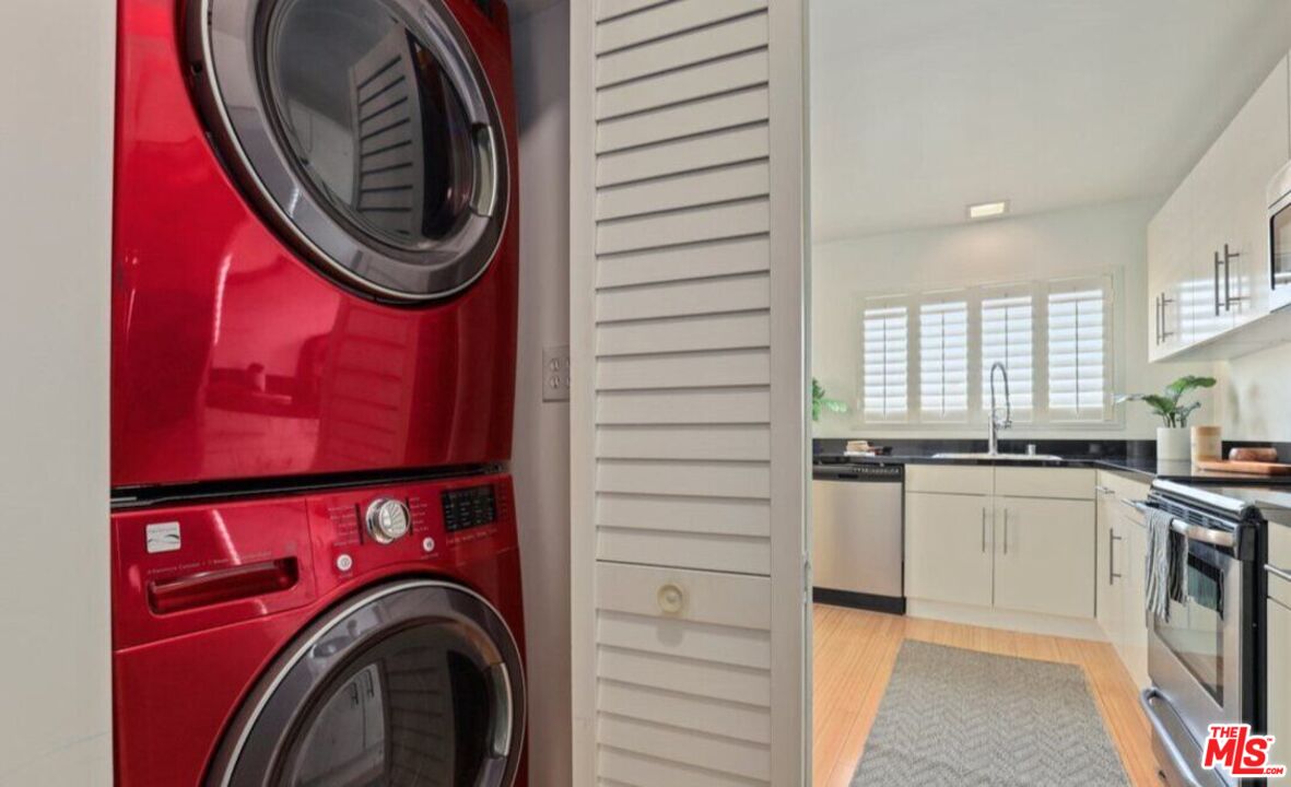 6624 South Springpark Avenue, Unit 5A Los Angeles, CA 90056 - Photo 19 of 23 a kitchen with stainless steel appliances granite countertop a stove a washer and dryer