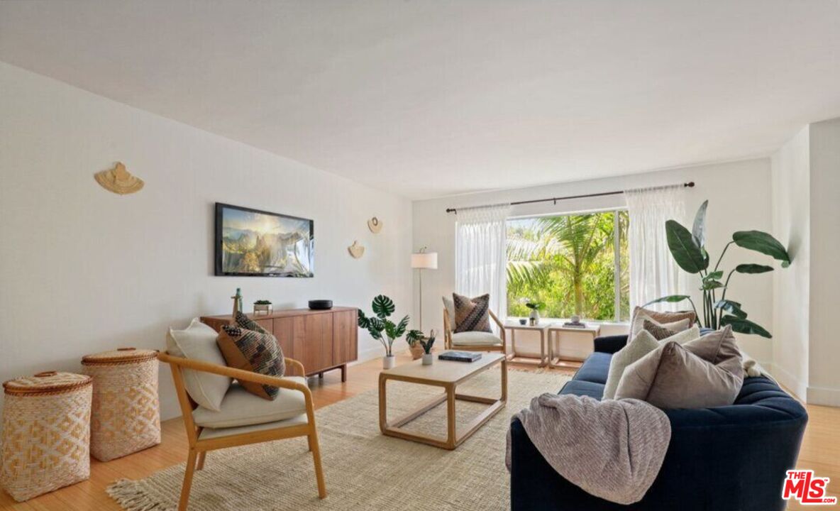 6624 South Springpark Avenue, Unit 5A Los Angeles, CA 90056 - Photo 3 of 23 a living room with furniture and a large window