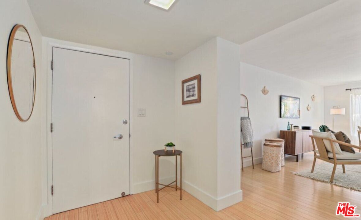 6624 South Springpark Avenue, Unit 5A Los Angeles, CA 90056 - Photo 6 of 23 a view of a livingroom with furniture and hardwood floor