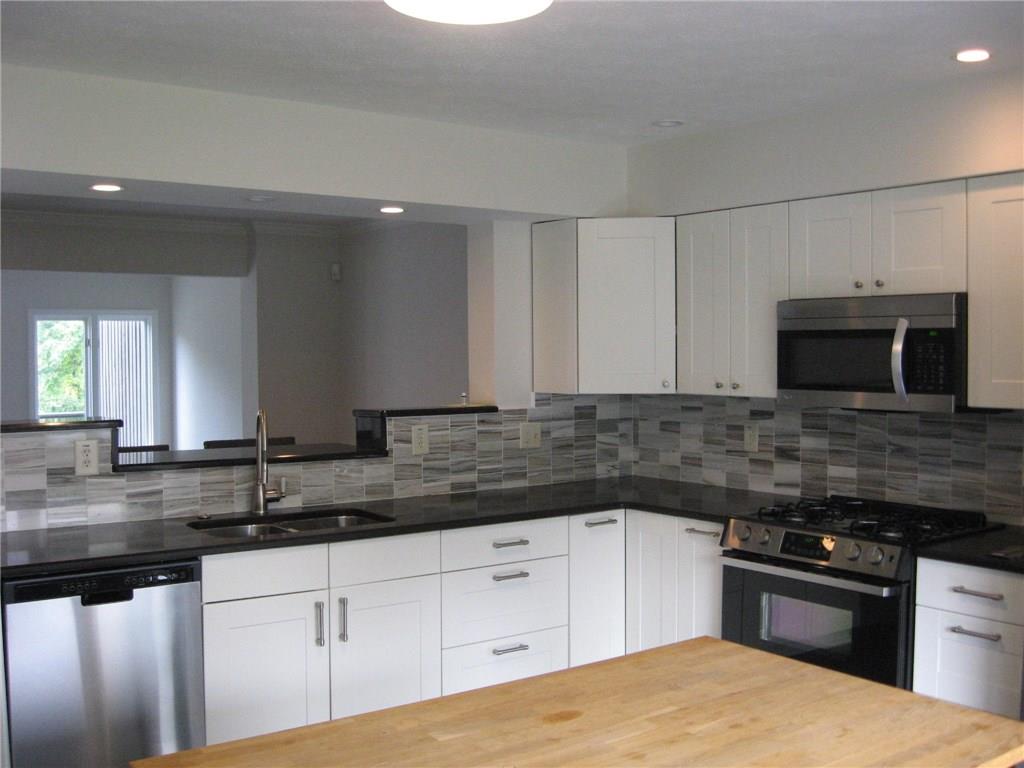 150 Shadow Ridge Drive Pittsburgh, PA 15238 - Photo 9 of 23 BRAND NEW STAINLESS KITCHEN W/ SUBWAY DECORATIVE TILE - SPECTACULAR!