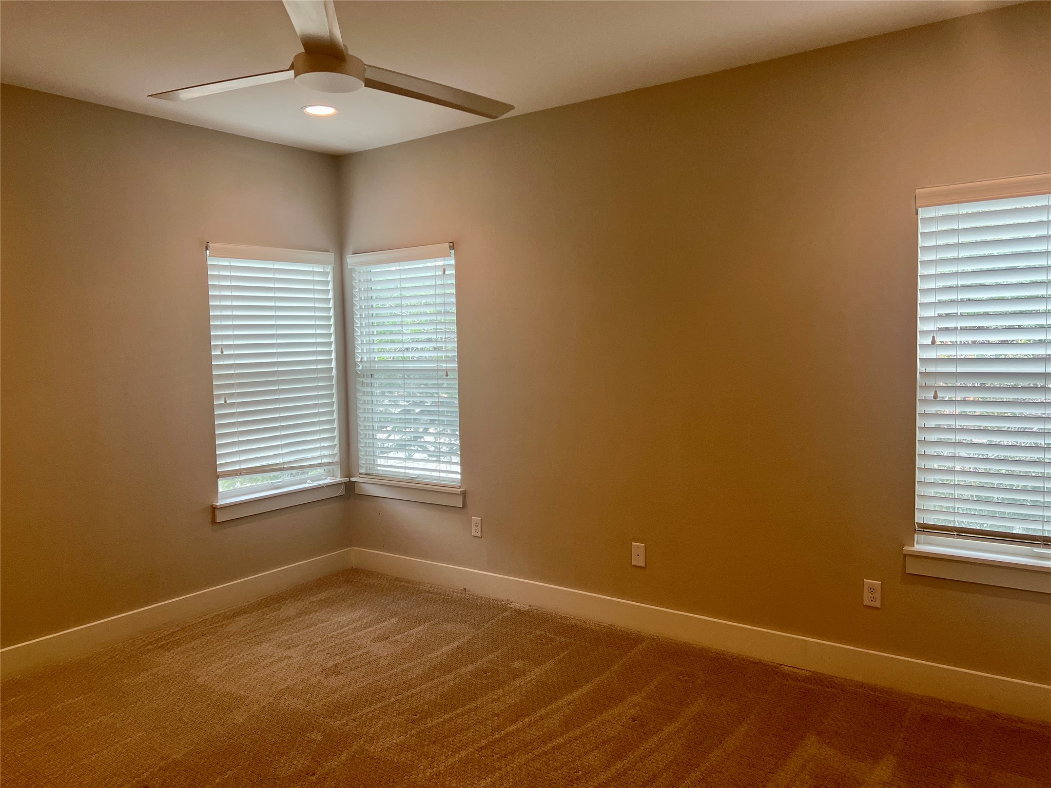 6515 Davis Lane, Unit 10 Austin, TX 78749 - Photo 11 of 22 An inviting bedroom with plush carpeting and natural light from multiple windows.