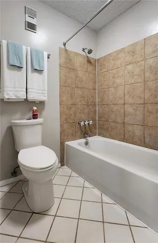 a bathroom with a toilet a sink and bathtub