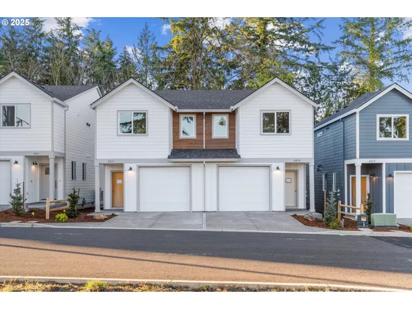 a front view of a house with garage