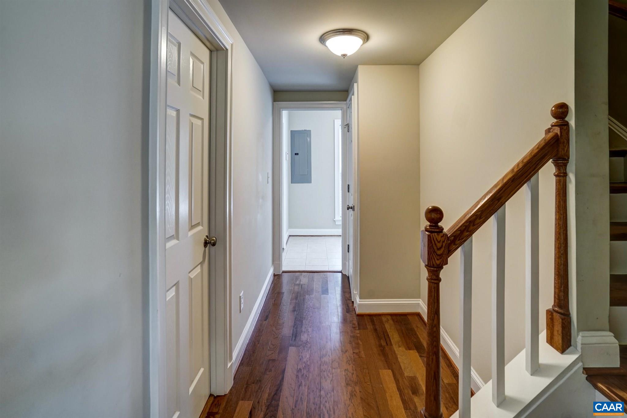 5327 Raven Stone Road Crozet, VA 22932 - Photo 39 of 67 a view of a hallway with wooden floor and staircase