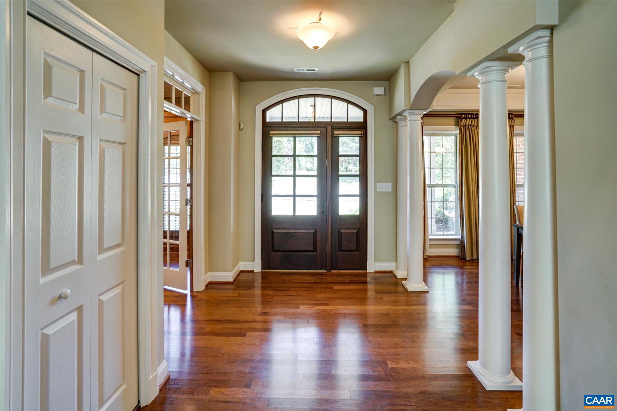 5327 Raven Stone Road Crozet, VA 22932 - Photo 9 of 67 a view of an entryway with wooden floor and door