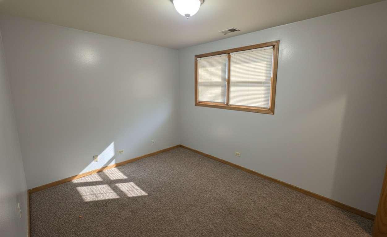 445 West 37th Street, Unit GARDEN Chicago, IL 60609 - Photo 4 of 9 an empty room with a window