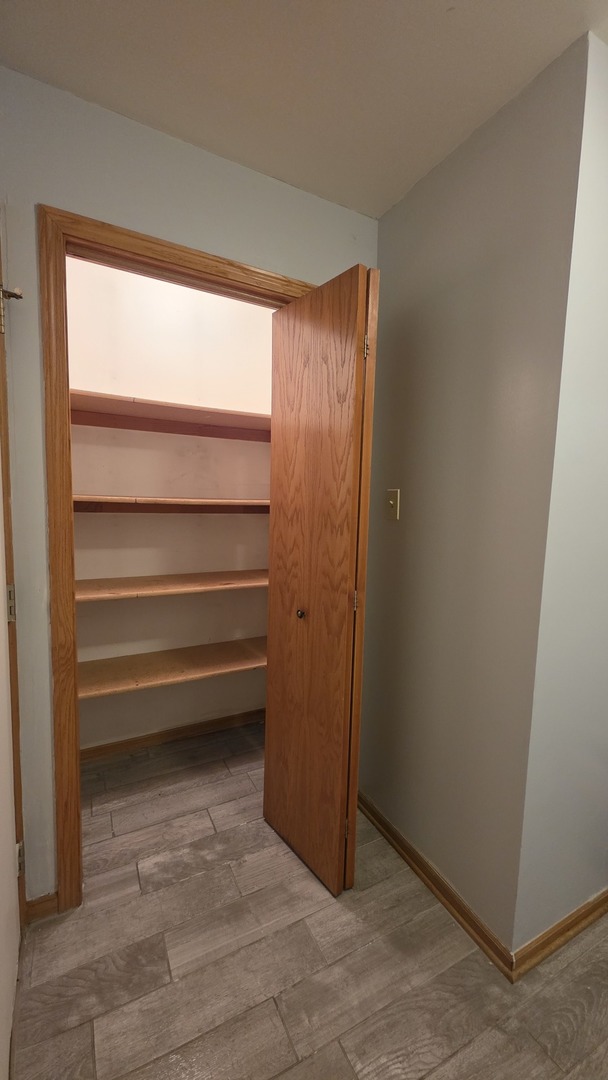 445 West 37th Street, Unit GARDEN Chicago, IL 60609 - Photo 5 of 9 a view of room with air conditioner and window