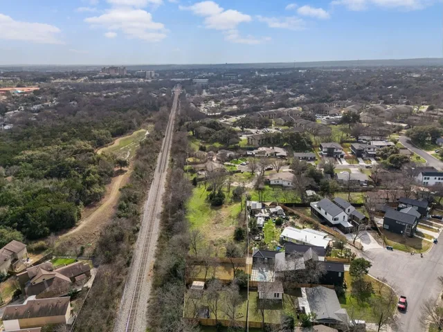 an aerial view of a house with a garden
