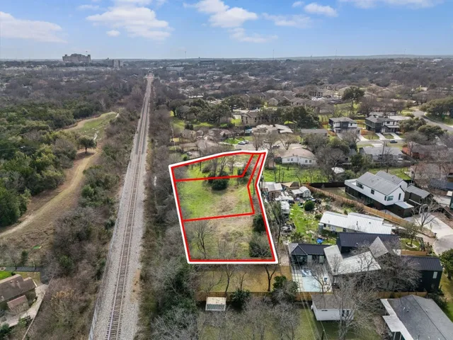 an aerial view of residential building with parking space