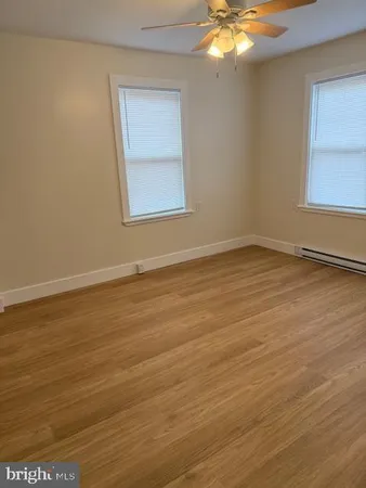a view of an empty room with windows
