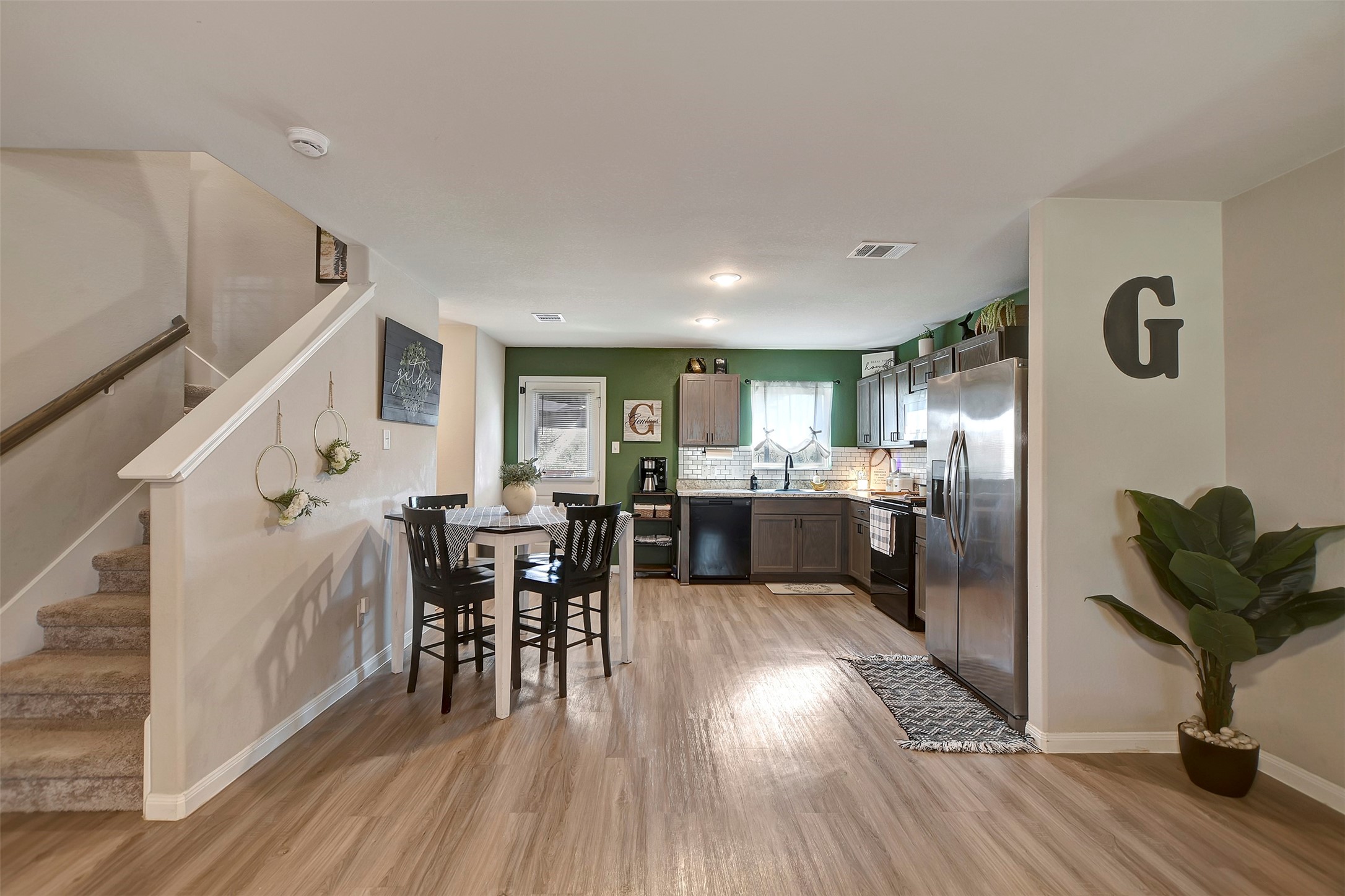 950 21st Street Hempstead, TX 77445 - Photo 11 of 35 a kitchen with furniture and wooden floors
