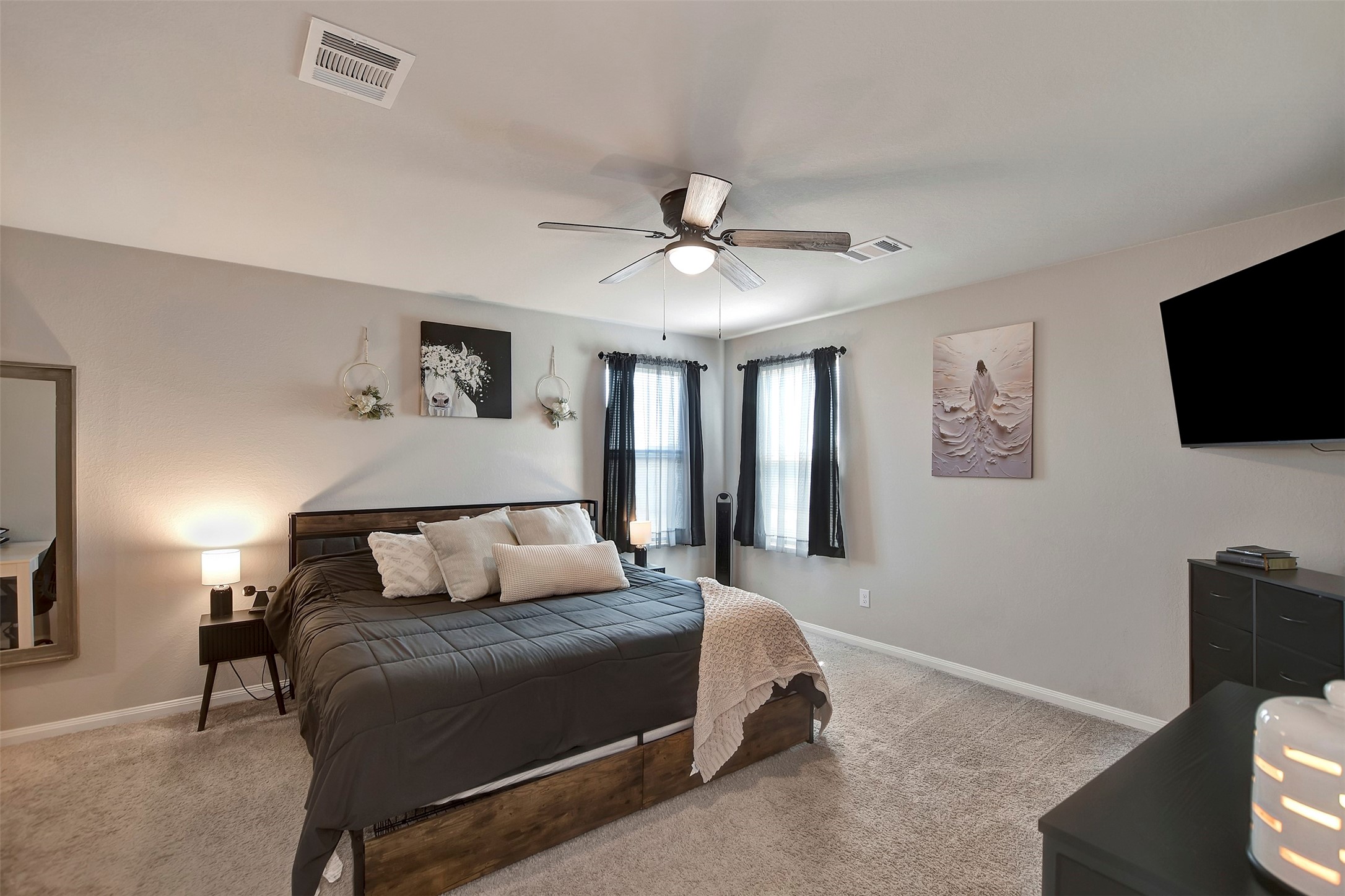 950 21st Street Hempstead, TX 77445 - Photo 20 of 35 a bedroom with a bed and a flat screen tv