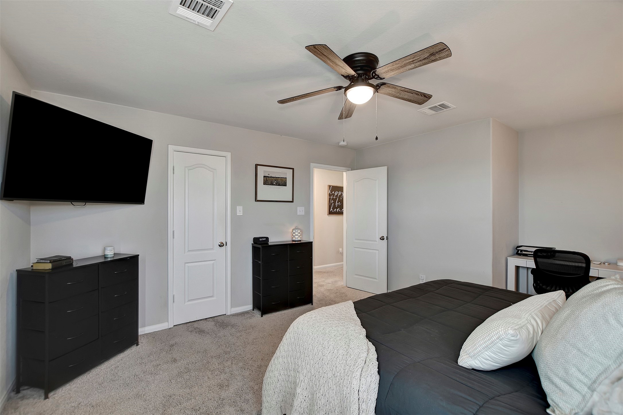 950 21st Street Hempstead, TX 77445 - Photo 22 of 35 a bedroom with a bed and a flat screen tv