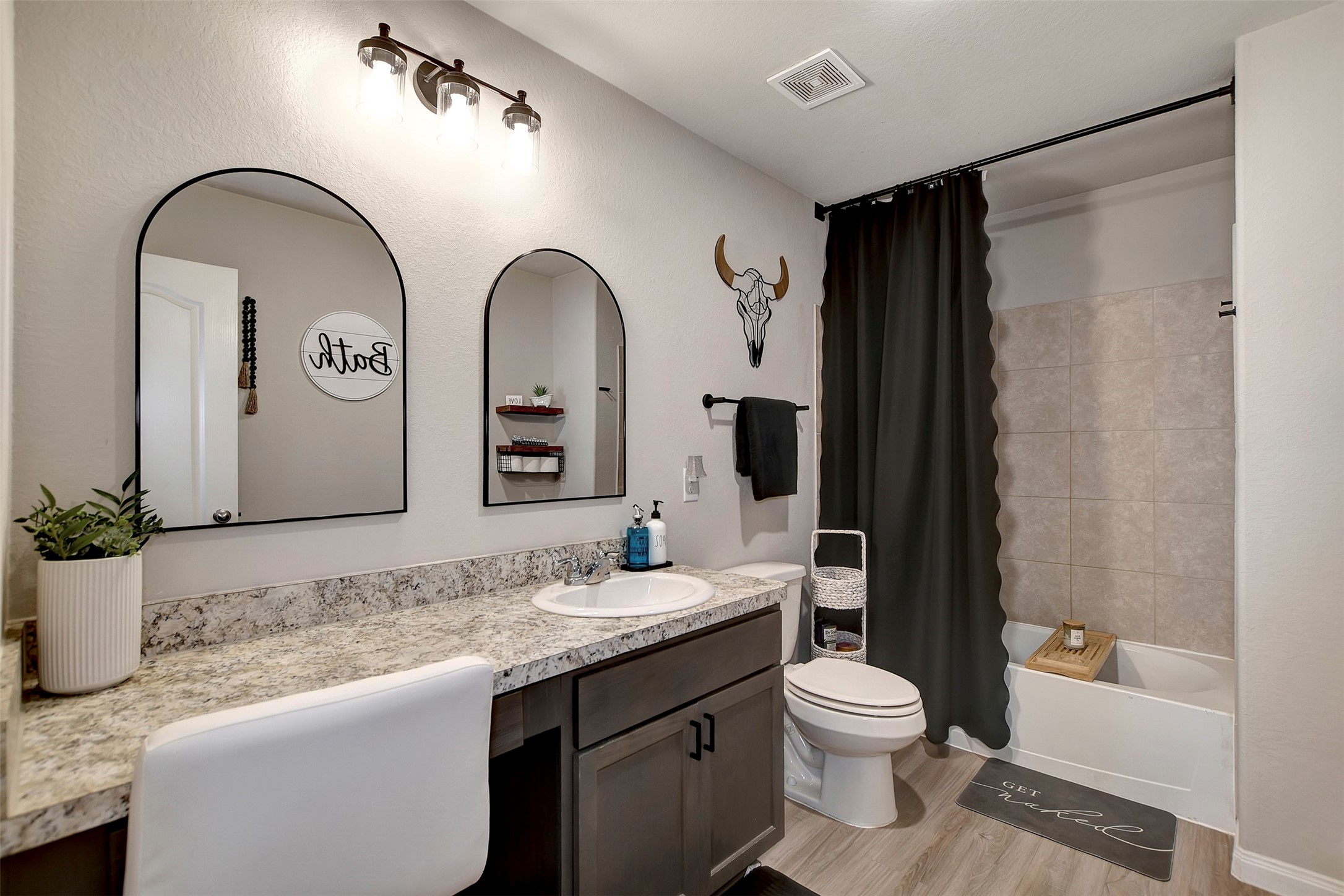 950 21st Street Hempstead, TX 77445 - Photo 23 of 35 a bathroom with a granite countertop sink toilet and shower