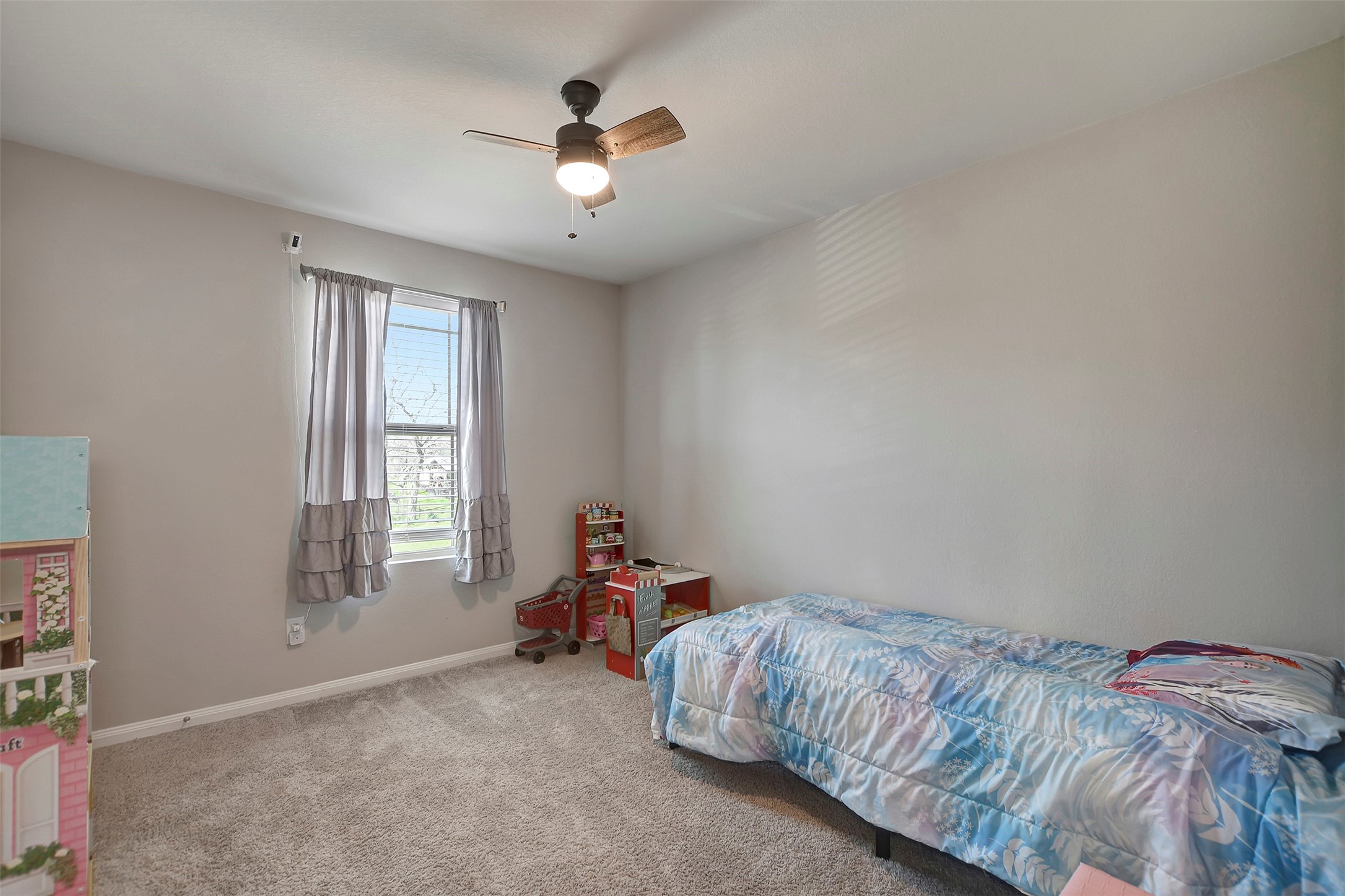 950 21st Street Hempstead, TX 77445 - Photo 28 of 35 a bed room with a bed and a window