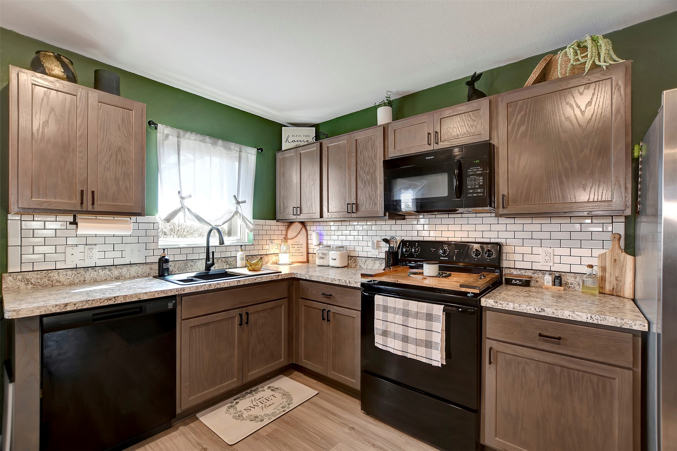 950 21st Street Hempstead, TX 77445 - Photo 8 of 35 a kitchen with a sink stove top oven and cabinets