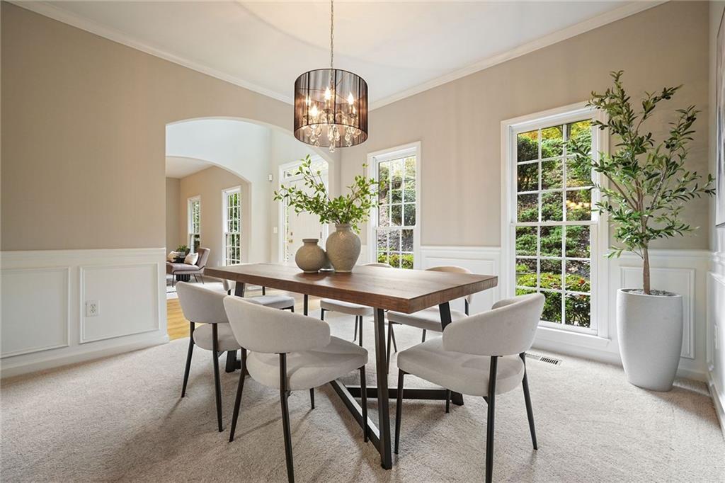4555 Dennington Trace Cumming, GA 30028 - Photo 12 of 64 a view of a dining room with furniture window and wooden floor