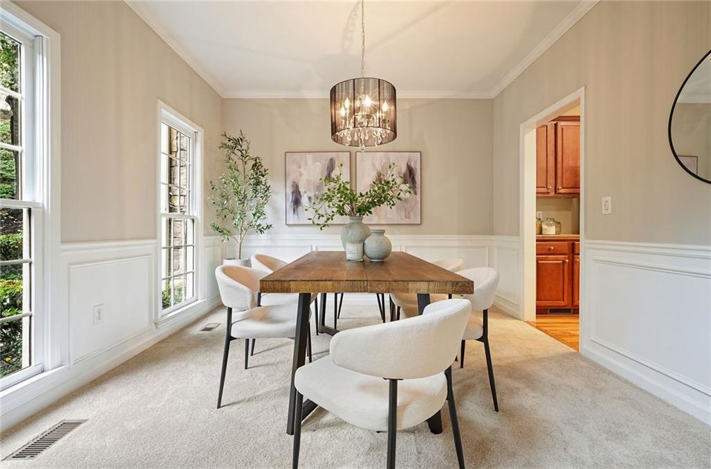 4555 Dennington Trace Cumming, GA 30028 - Photo 13 of 64 a view of a dining room with furniture window and wooden floor