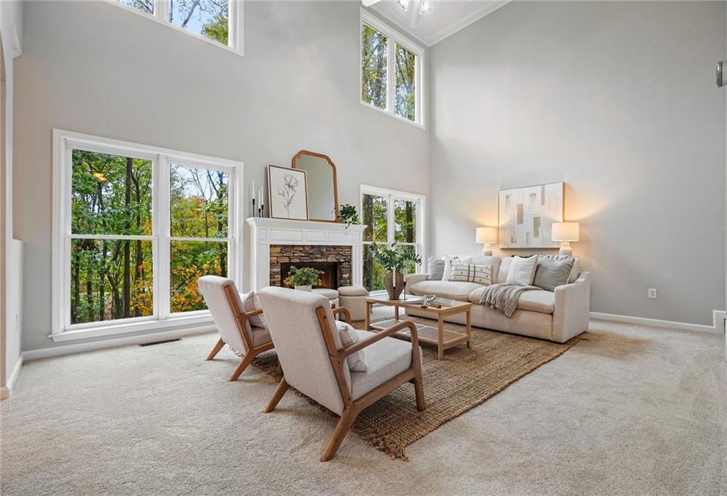 4555 Dennington Trace Cumming, GA 30028 - Photo 14 of 64 a living room with furniture and a fireplace