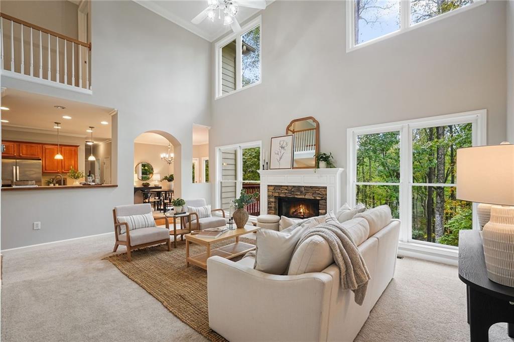 4555 Dennington Trace Cumming, GA 30028 - Photo 15 of 64 a living room with furniture and a fireplace