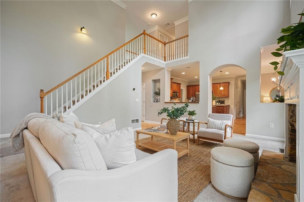 4555 Dennington Trace Cumming, GA 30028 - Photo 16 of 64 a living room with furniture and a potted plant