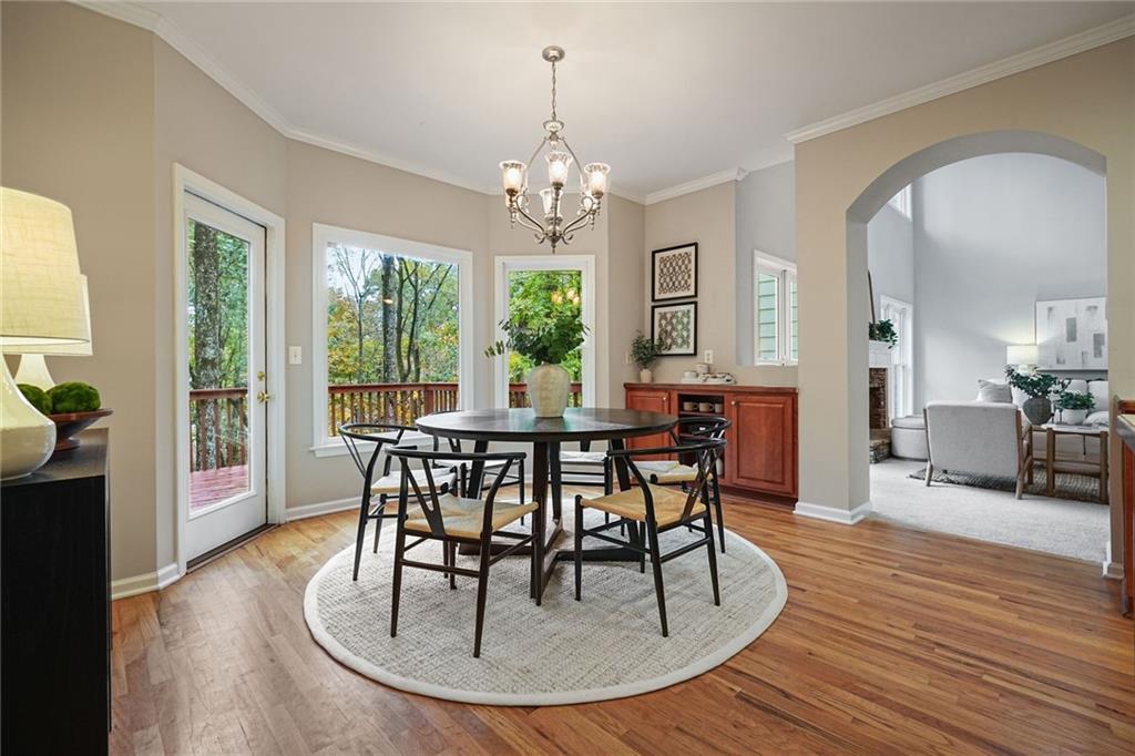 4555 Dennington Trace Cumming, GA 30028 - Photo 17 of 64 a view of a dining room with furniture window and wooden floor