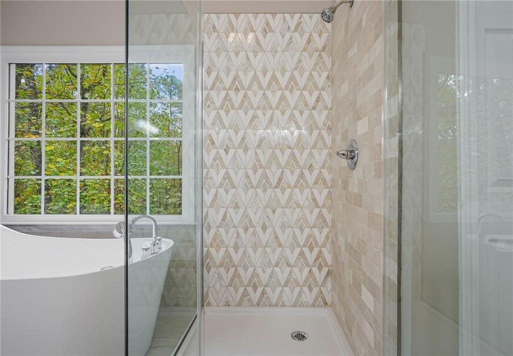 4555 Dennington Trace Cumming, GA 30028 - Photo 29 of 64 a bathroom with a shower
