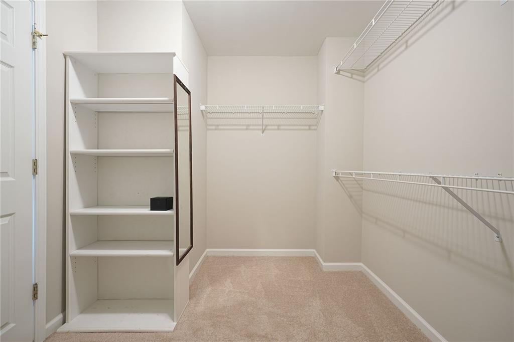 4555 Dennington Trace Cumming, GA 30028 - Photo 32 of 64 a view of an empty walk in closet