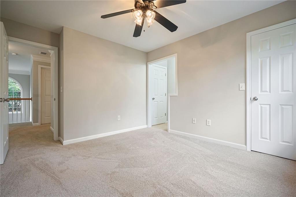 4555 Dennington Trace Cumming, GA 30028 - Photo 35 of 64 an empty room with chandelier fan