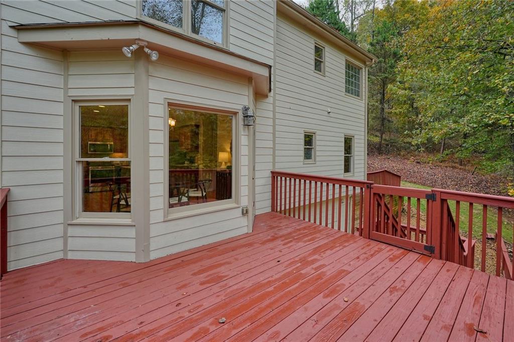 4555 Dennington Trace Cumming, GA 30028 - Photo 47 of 64 a view of a house with a deck