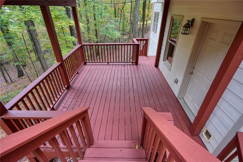4555 Dennington Trace Cumming, GA 30028 - Photo 48 of 64 a view of a balcony with wooden floor