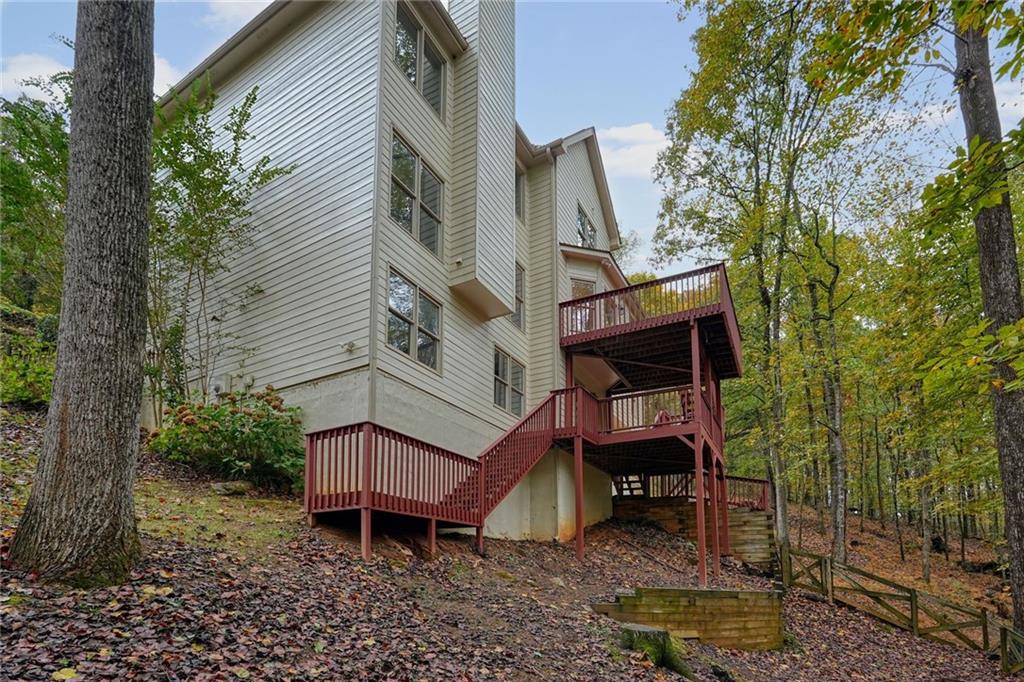 4555 Dennington Trace Cumming, GA 30028 - Photo 51 of 64 a view of a house with a yard and sitting area