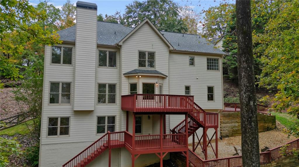 4555 Dennington Trace Cumming, GA 30028 - Photo 55 of 64 a front view of a house with a chairs and table