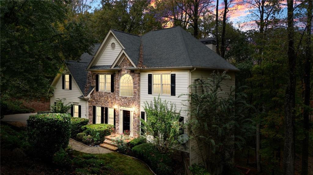 4555 Dennington Trace Cumming, GA 30028 - Photo 56 of 64 a front view of house with yard and green space