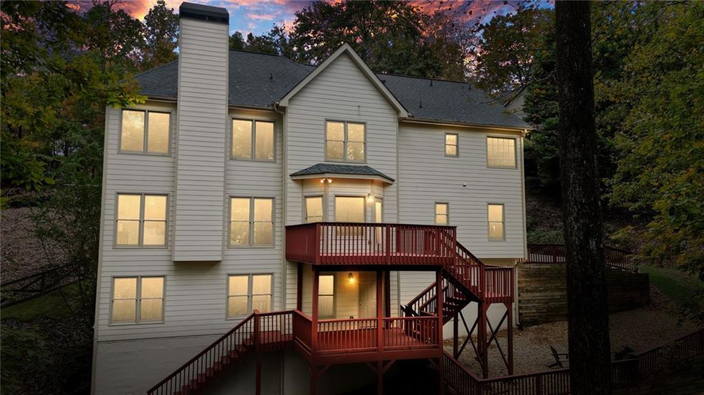 4555 Dennington Trace Cumming, GA 30028 - Photo 57 of 64 a front view of a house with a porch