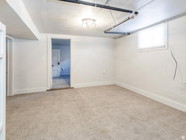 227 West 200 North Logan, UT 84321 - Photo 33 of 44 Carpeted room featuring white painted walls and a recessed window