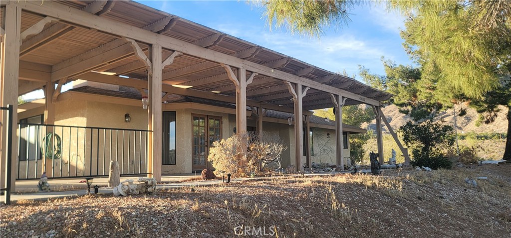 49833 Maccele Road Morongo Valley, CA 92256 - Photo 11 of 24 a front view of a house with a yard