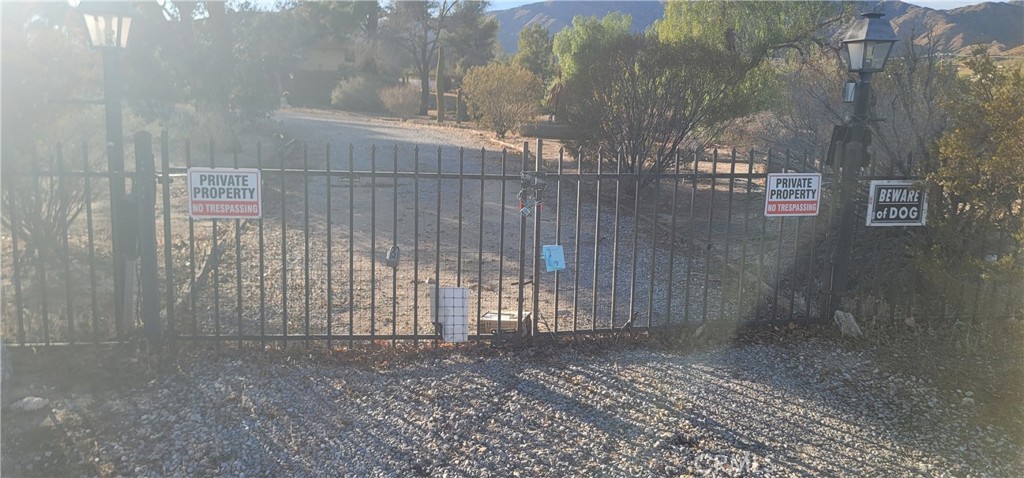 49833 Maccele Road Morongo Valley, CA 92256 - Photo 21 of 24 a view of outdoor space with wooden fence