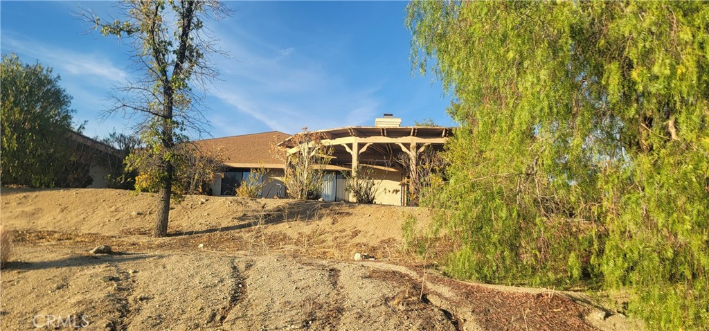49833 Maccele Road Morongo Valley, CA 92256 - Photo 4 of 24 a view of a house with snow on the background