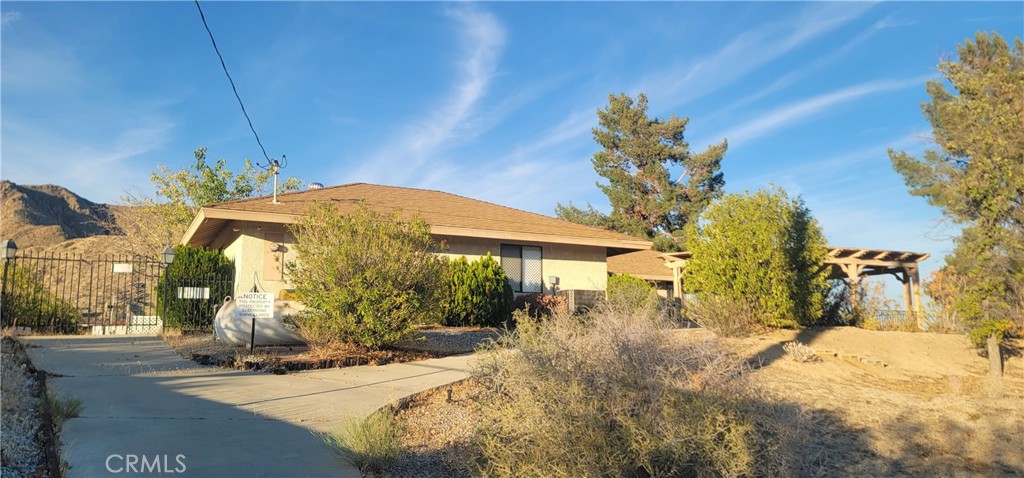 49833 Maccele Road Morongo Valley, CA 92256 - Photo 5 of 24 a view of a house with a yard