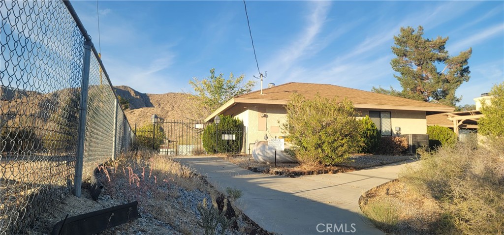49833 Maccele Road Morongo Valley, CA 92256 - Photo 6 of 24 a view of a house with backyard