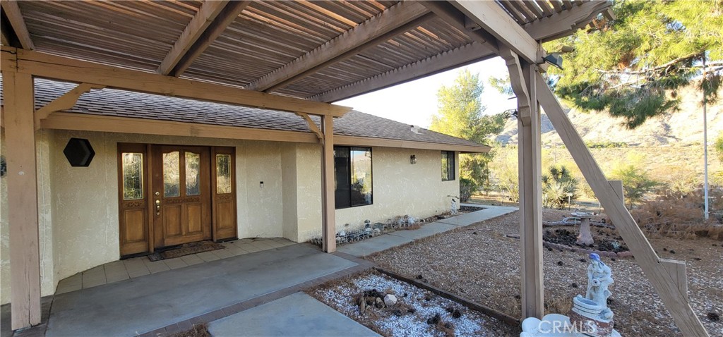 49833 Maccele Road Morongo Valley, CA 92256 - Photo 8 of 24 a front view of a house