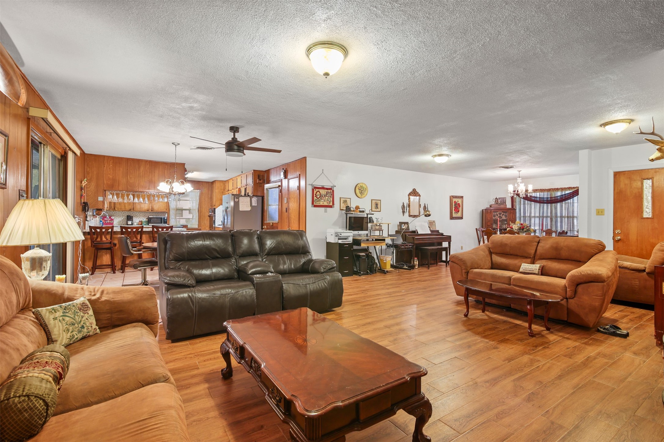 8406 East Mt Houston Road Houston, TX 77050 - Photo 5 of 30 a living room with furniture kitchen view and a wooden floor