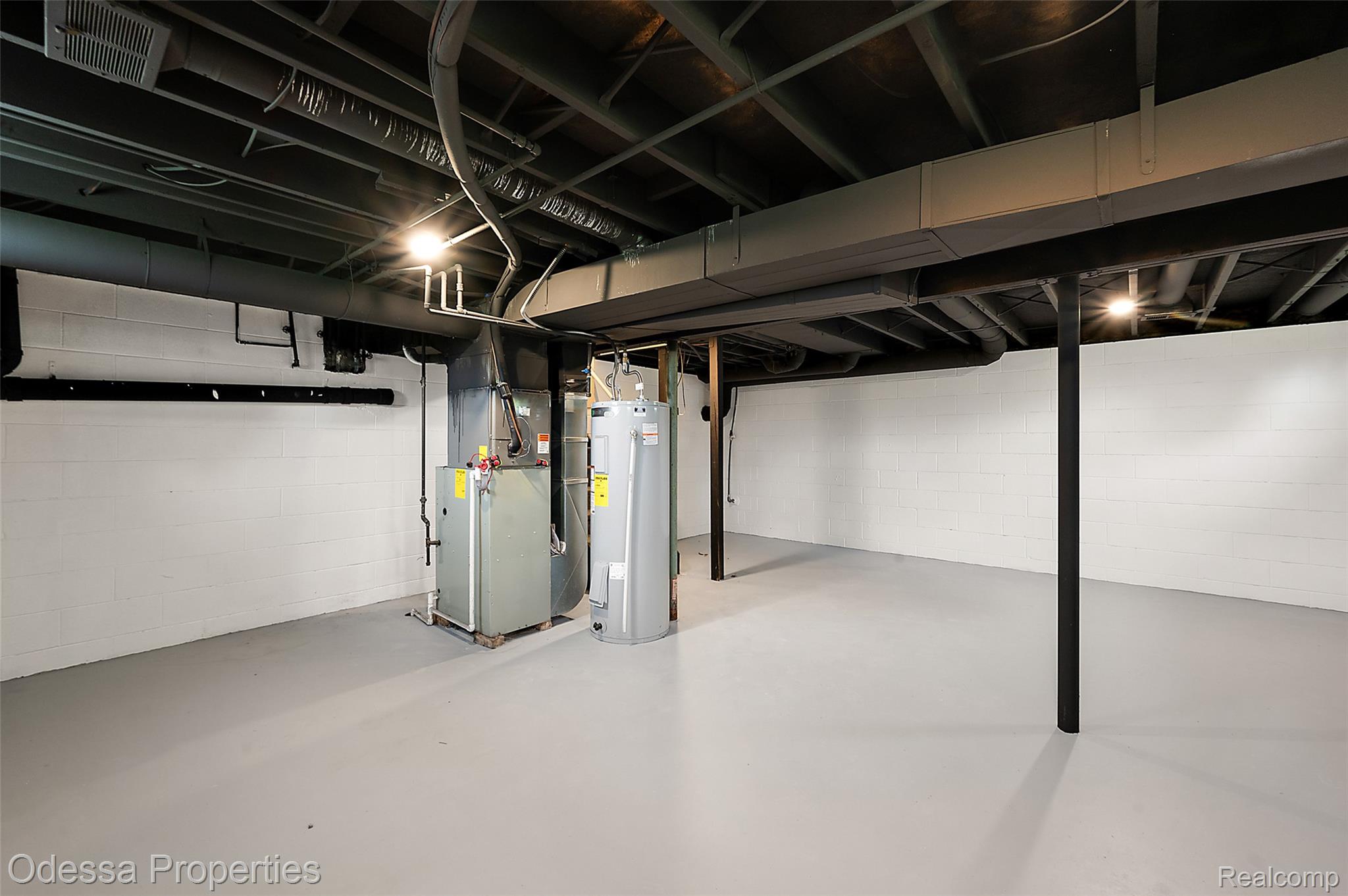 1442 Riley Center Road Memphis, MI 48041 - Photo 43 of 62 Basement with heating unit and electric water heater