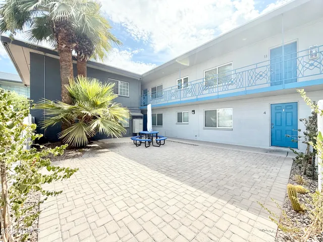 a potted plant sitting in front of a house