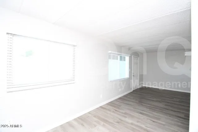 a view of a small space with wooden floor