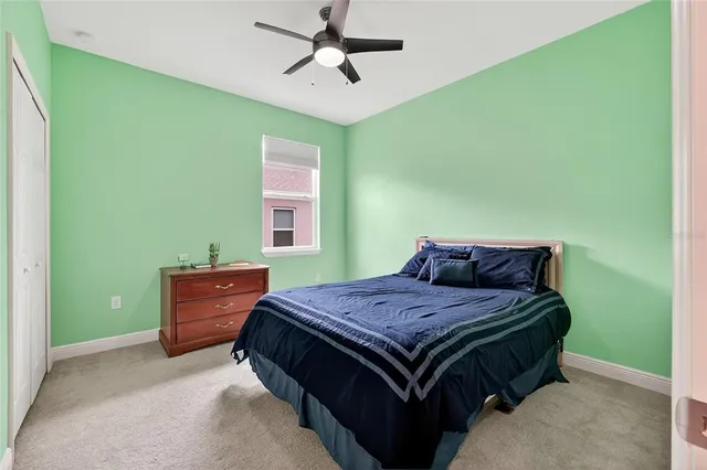 a bathroom with a sink vanity mirror and toilet
