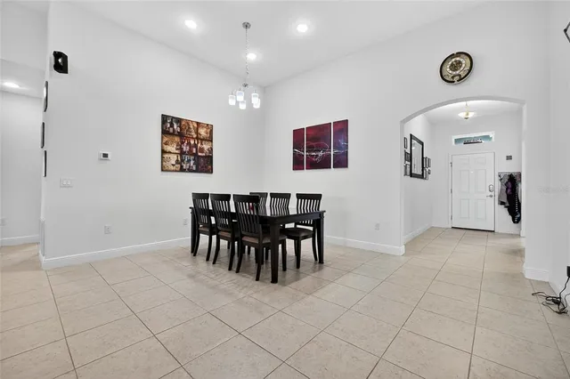 a view of a workspace with furniture and gym equipment
