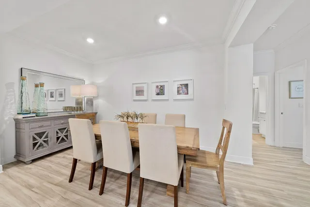 a view of a dining room with furniture and wooden floor